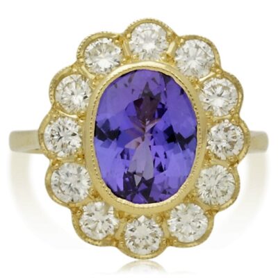 PRE-OWNED 18CT GOLD TANZANITE & DIAMOND CLUSTER RING.